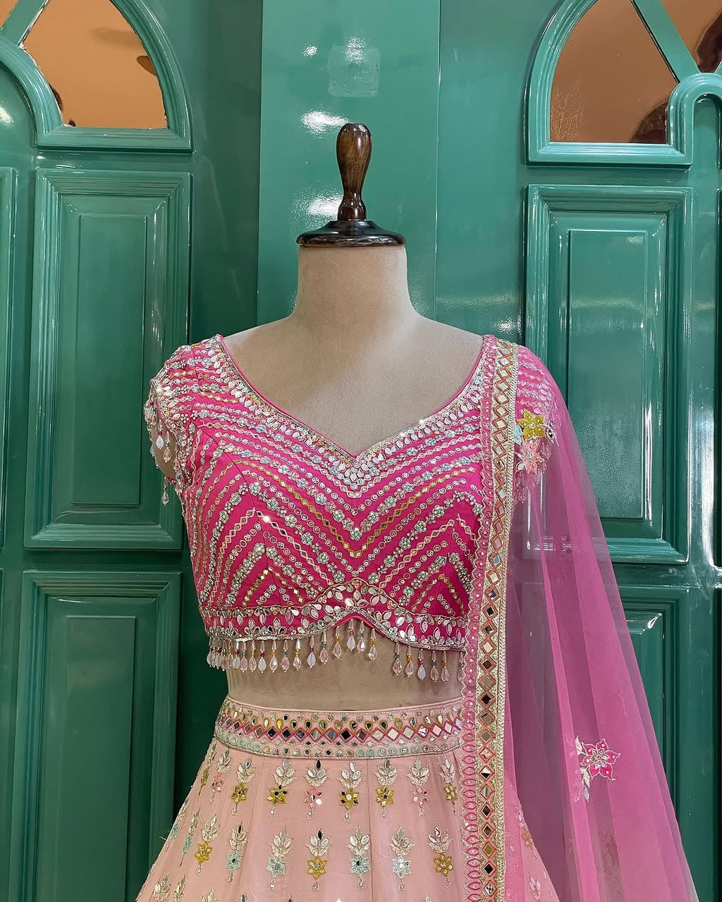 Beautiful Pastel Blush Pink Floral Mirror Work Lehenga Choli with Hot Pink Embroidered Blouse & Net Dupatta