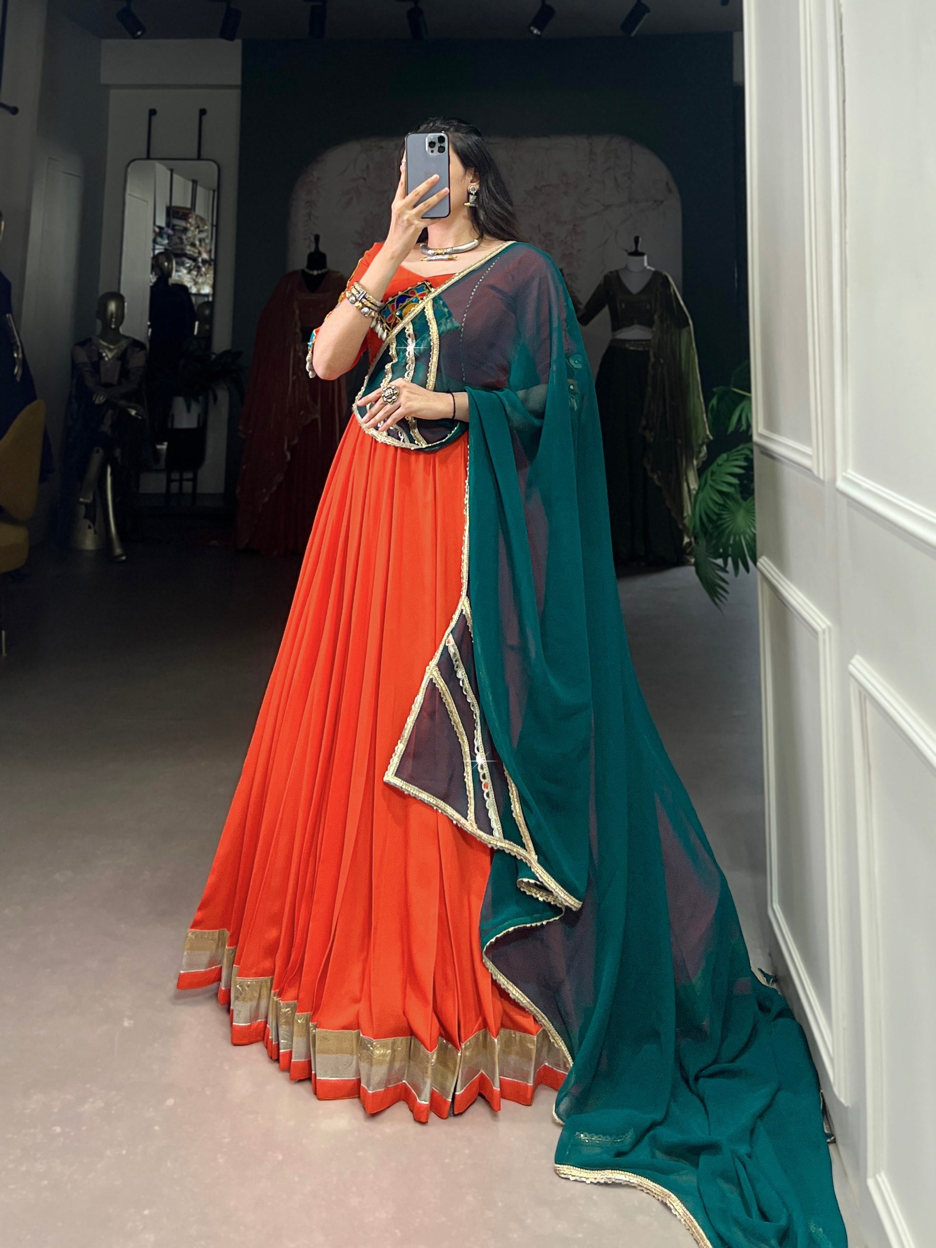 Magnificent Orange Pure Rayon Embossed Navratri Lehenga Choli - ETHNICDEAL