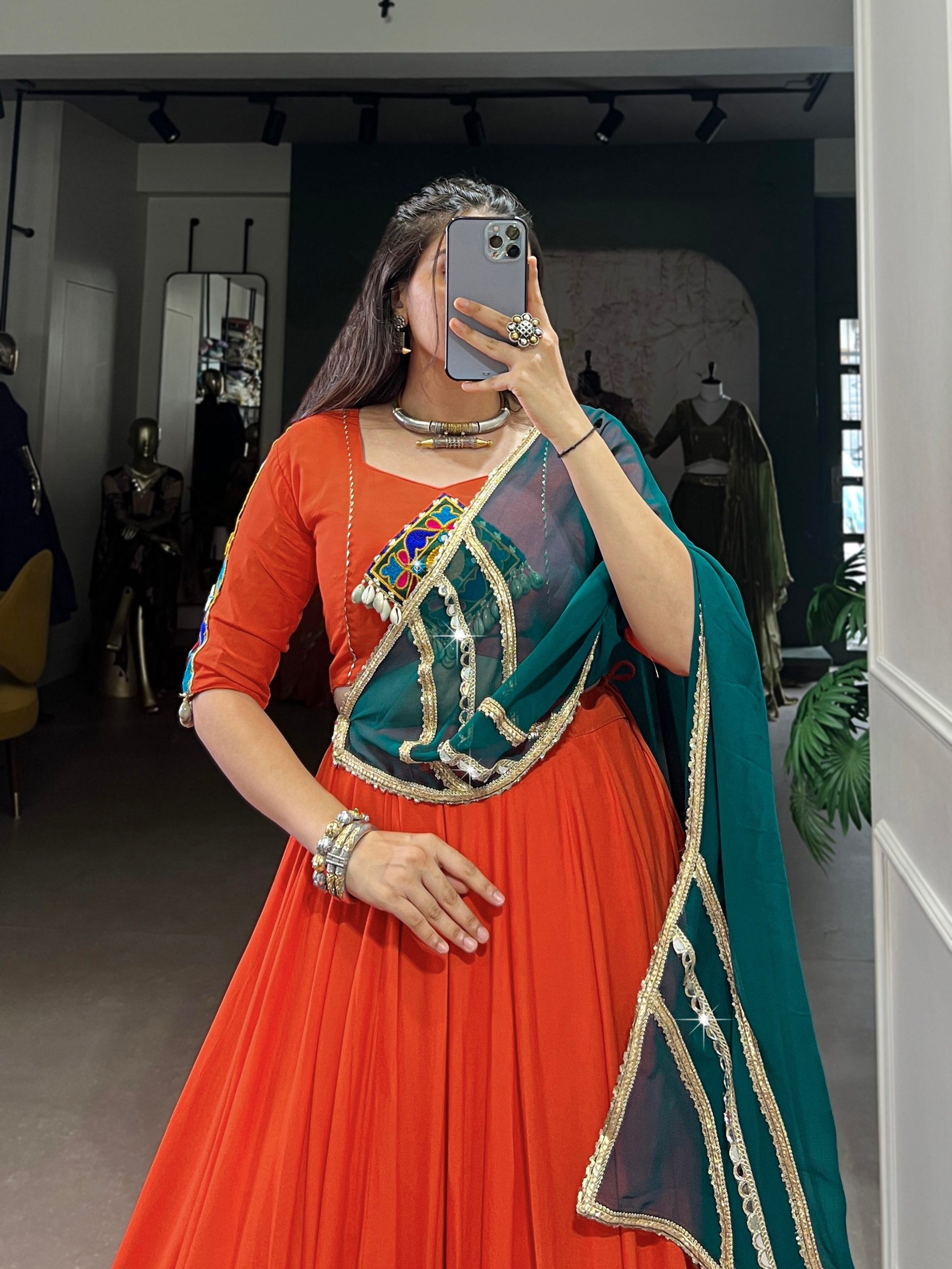Magnificent Orange Pure Rayon Embossed Navratri Lehenga Choli - ETHNICDEAL